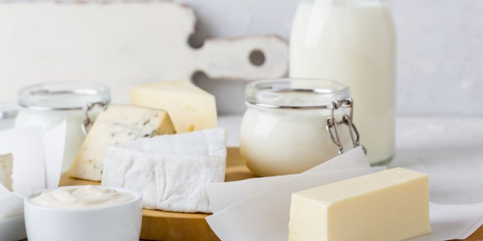fresh organic dairy products on white table