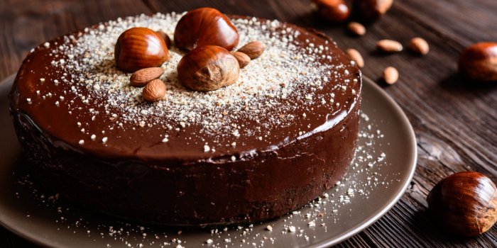 delicious chestnut cake with almonds and chocolate glaze
